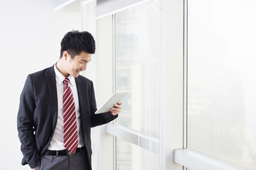 Fototapeta premium handsome asian businessman in modern office