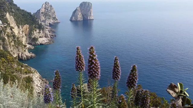 Capri (Naples), Campania area, Italy. Aerial footage of the beautiful and well known Faraglioni. The three spurs of rock which rise up out of the sea in a wonderful day.