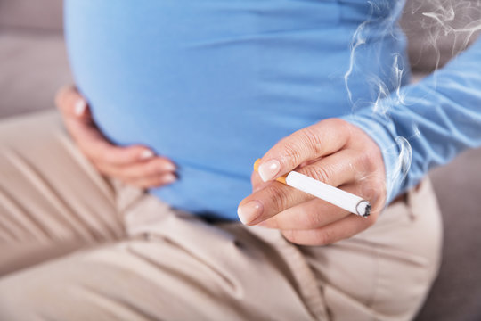 Pregnant Women Smoking Cigarette