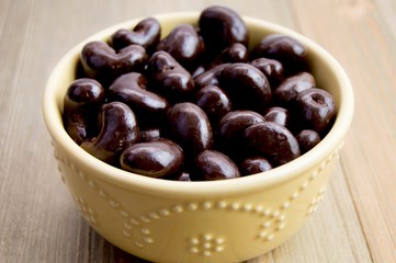 Chocolate covered cashews in a pretty bowl