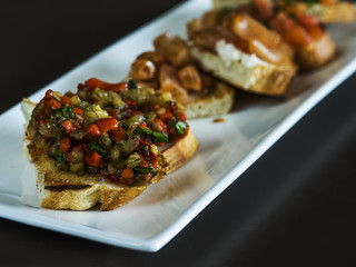 Selection of tasty bruschetta or canapes on taosted baguette