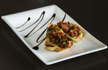 Selection of tasty bruschetta or canapes on taosted baguette