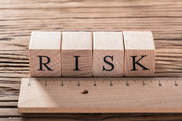 Risk Concept With Wooden Ruler