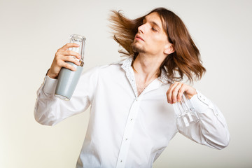 Long haired barman shaking head.