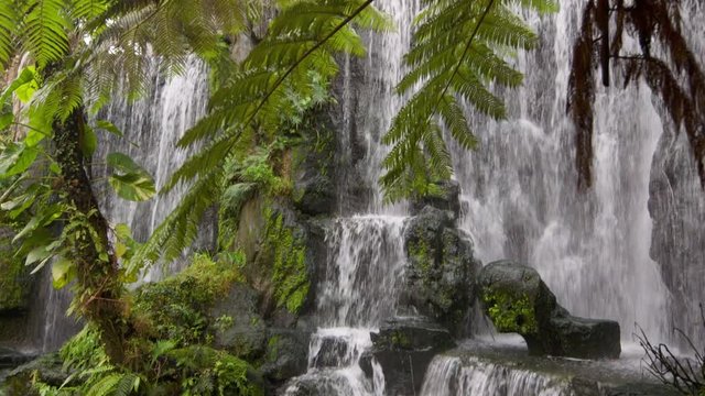 Waterfall and foliage inside Longshan Temple in Taipei, Taiwan. The waterfall is there to help cleanse your mind and spirit before entering the temple.