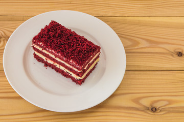 red velvet slice of cake on white plate