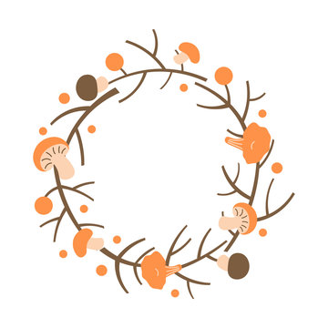 Decorative autumn wreath. Frame made of branches, berries and mushrooms.