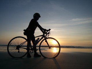 Fototapeta na wymiar Cycling to a seaside in the Gulf of Thailand.