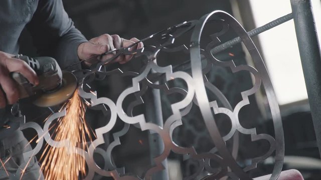 Decorative metalworking: the creation of an openwork decorative metal element. The process of creating a decorative metal product: forged openwork metal. The metal lacework.
