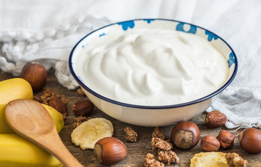 Serving of White Yogurt with  Muesli, Banana and Nuts