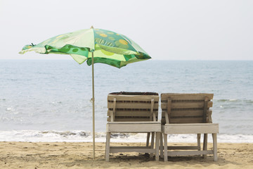 Chairs with Umbrella on the beach near ocean