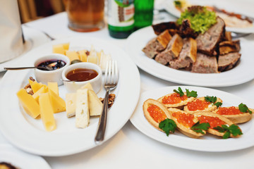 Cheese served on plate with sauces