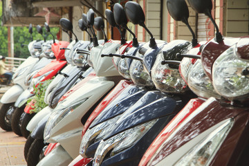 Scooters parked on a city street