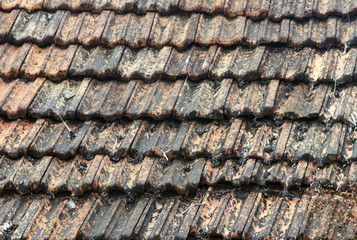 The roof is covered with brown tiles close up