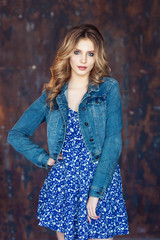Fototapeta premium Beautiful young girl in a blue sarafan