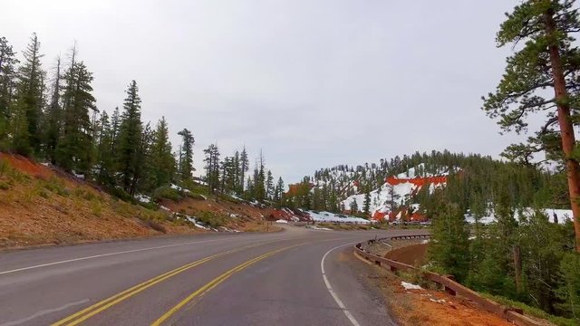 Incredibly beautiful landscape in Bryce Canyon spring road driving POV. Geological formation weather water erosion. Nature ecological sensitive landscape and tourist destination.