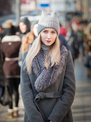 Fototapeta premium Portrait of young woman at sunny winter day.