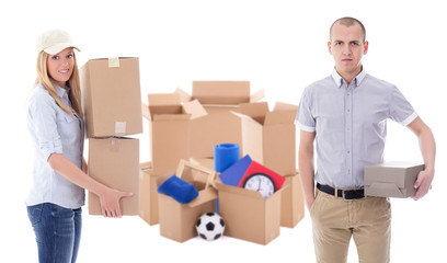 moving day or delivery concept - young man and woman with brown cardboard boxes with stuff isolated on white