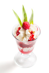 Sweet raspberry dessert with whipped cream on a white background