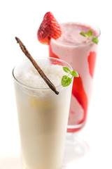 Closeup of strawberry and vanilla smoothies on white background