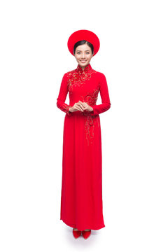 Full length of Vietnamese Bride in Red Ao Dai Traditional Dress with hat.