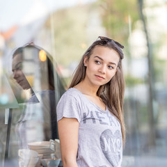 women at store window 