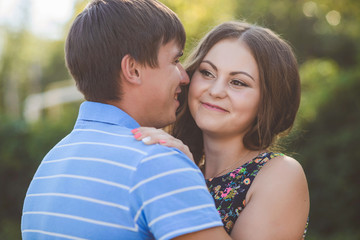 Couple in love hugging against the background of nature. Closeup