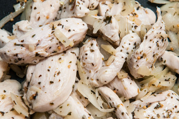 Seasoned Fresh Chicken pieces cooking in the frying pan