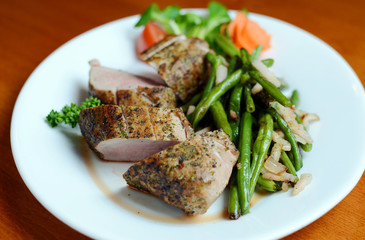 Steak with herbs on a plate in the pub.