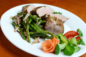 Steak with herbs on a plate in the pub.