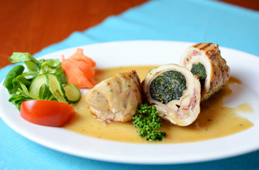 Plate with meat and vegetables in the pub.