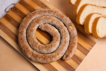Baked traditional homemade sausage with spices and herbs..