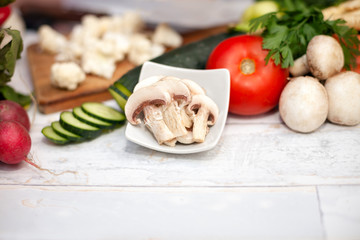 Slices of champignons in small bowl