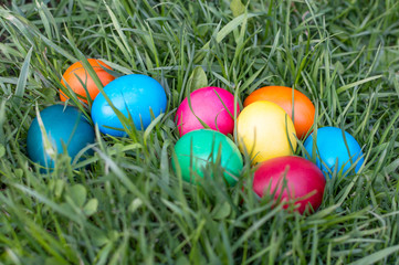 colored Easter eggs on the grass