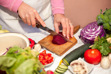 Woman cutting beetroot