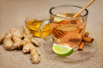 Ginger tea, raw ginger and dish with honey