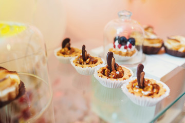 Baked baskets with nuts on glass box