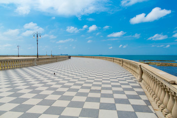 Seaside promenade in Livorno. Black and white tiles in a checkers right © guardalex