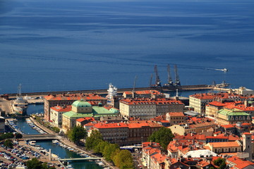 Sunny cityscape of Rijeka, the largest port of Croatia, with colorful rooftops of city center,  Rjecina river and the blue water of Kvarner Gulf, Adriatic Sea, from Trsat