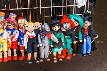 Traditional handicraft puppets are sold in a market in Prague, Czech Republic
