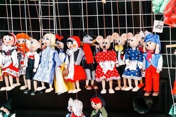 Traditional handicraft puppets are sold in a market in Prague, Czech Republic