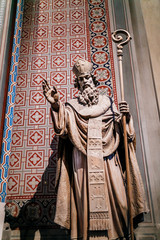 A statue of a Catholic saint in the interior of the ancient church of Cyril and Methodius in Prague