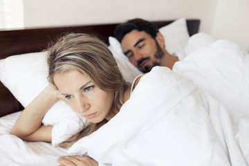 Obraz na płótnie Canvas Unhappy couple having problems at bedroom. Family conflict.
