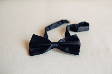 The wedding butterfly for groom  stands on the table