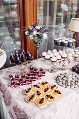The different desserts standing on the banquet table