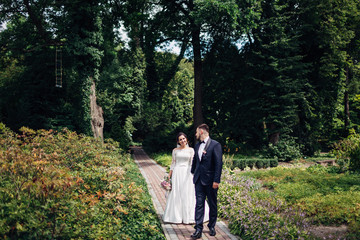 Fototapeta premium The lovely couple in love walking along park