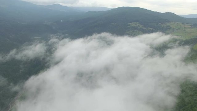 Beautiful Clouds In The Mountains. Drone Flight