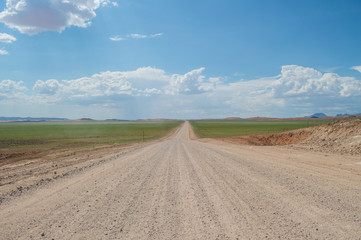 Scenic View of a Desert and Mountain Landscape with Road after the Rain, near Solitaire, Namibia