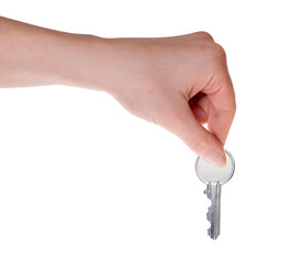 human hand holding steel key isolated on white