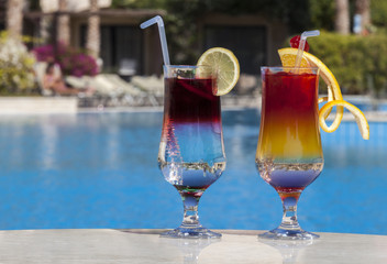Two cocktails by the pool